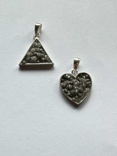 Heart and triangle pendant made of silver filled with diamonds