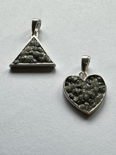 Heart and triangle pendant made of silver filled with diamonds