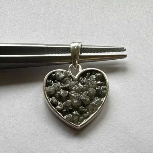 Heart and triangle pendant made of silver filled with diamonds