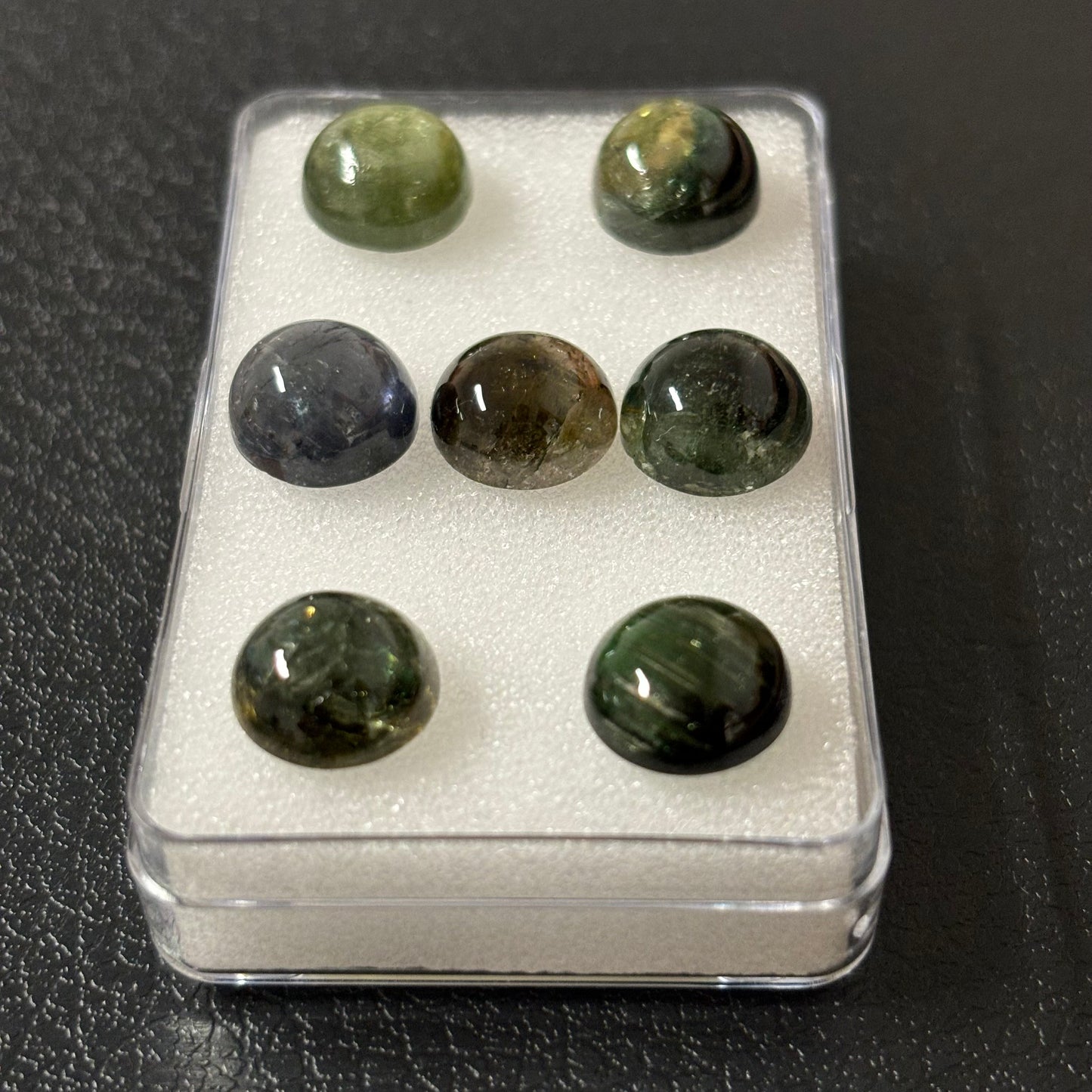 Tourmaline round cabochon with inclusions approx. 10 mm 4.56 Cts.