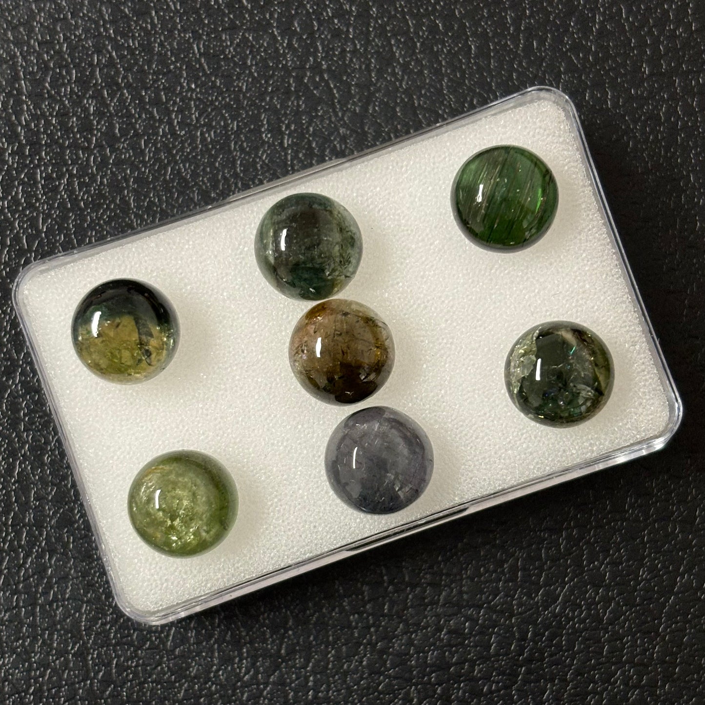 Tourmaline round cabochon with inclusions approx. 10 mm 4.56 Cts.