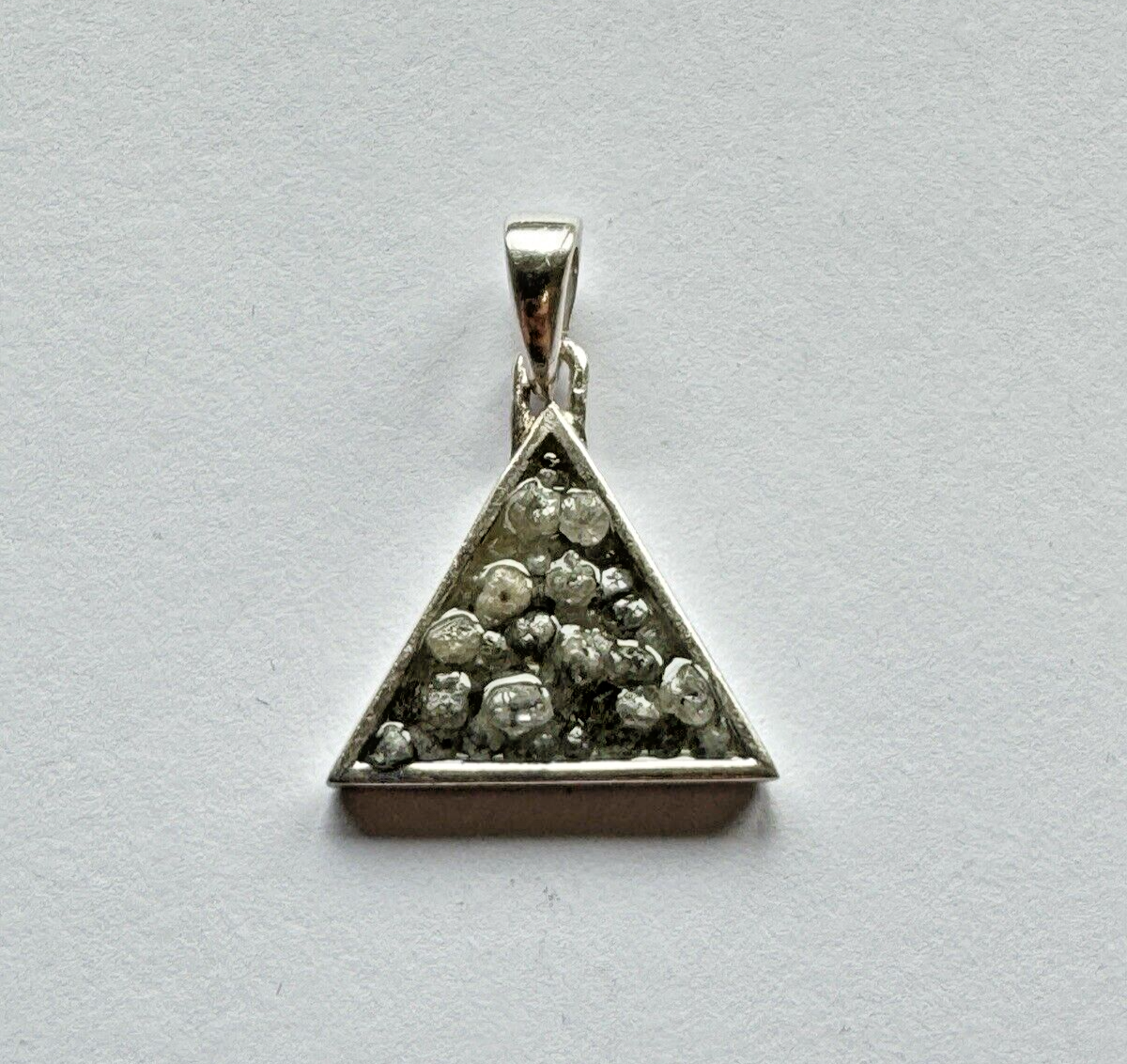 Heart and triangle pendant made of silver filled with diamonds
