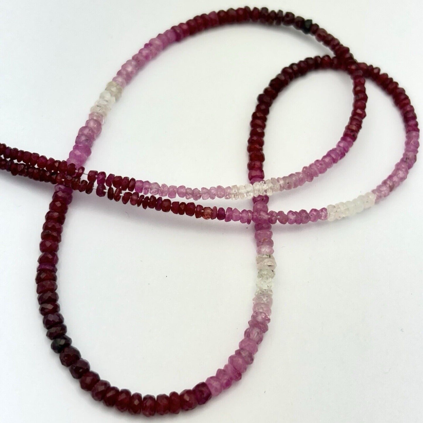 Delicate sapphire necklace faceted with gradient light pink to wine red