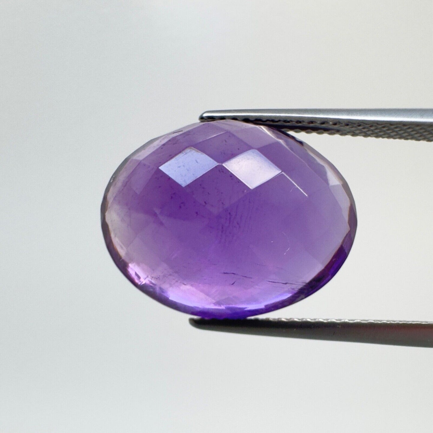 Amethyst Purple Oval Cut Faceted 18.6 x 14.6 mm 15.12 Carat With Inclusions