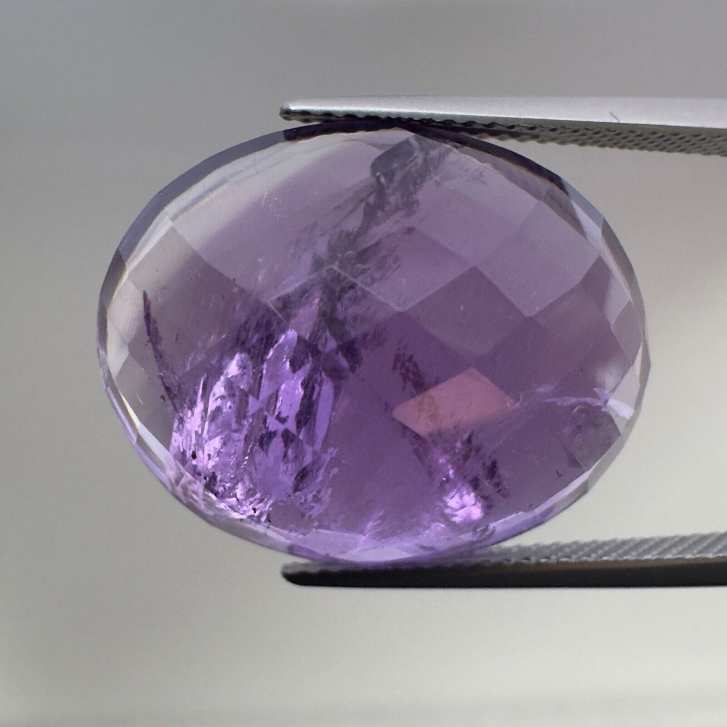 Amethyst Purple Oval Cut Faceted 22 x 18 mm 26.83 Carat With Inclusions