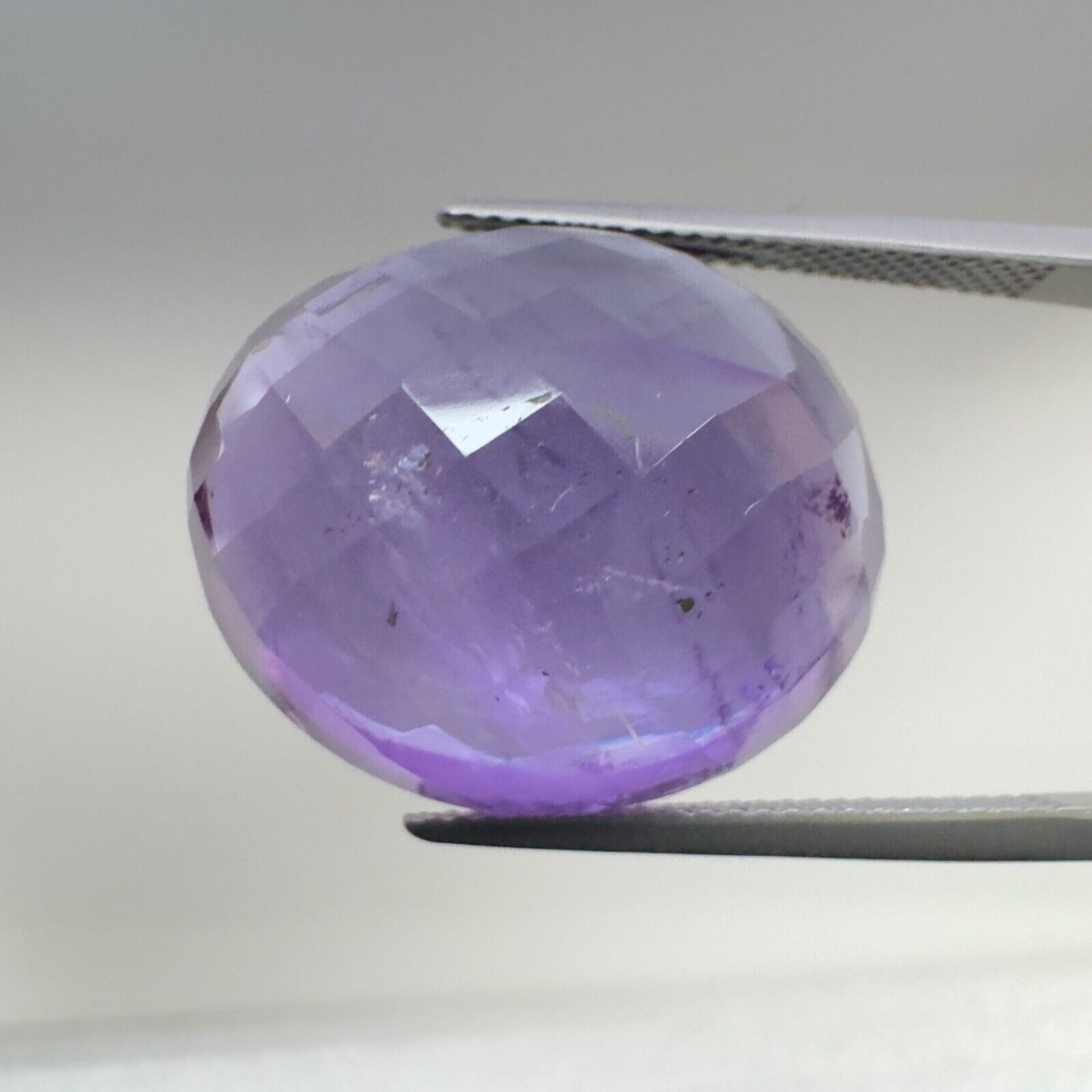 Amethyst Purple Oval Cut Faceted 22 x 18.5 mm 32.08 Carat With Inclusions