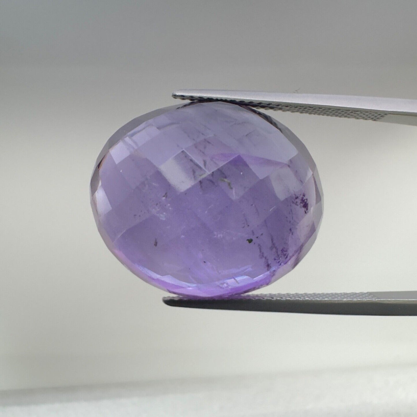 Amethyst Purple Oval Cut Faceted 22 x 18.5 mm 32.08 Carat With Inclusions