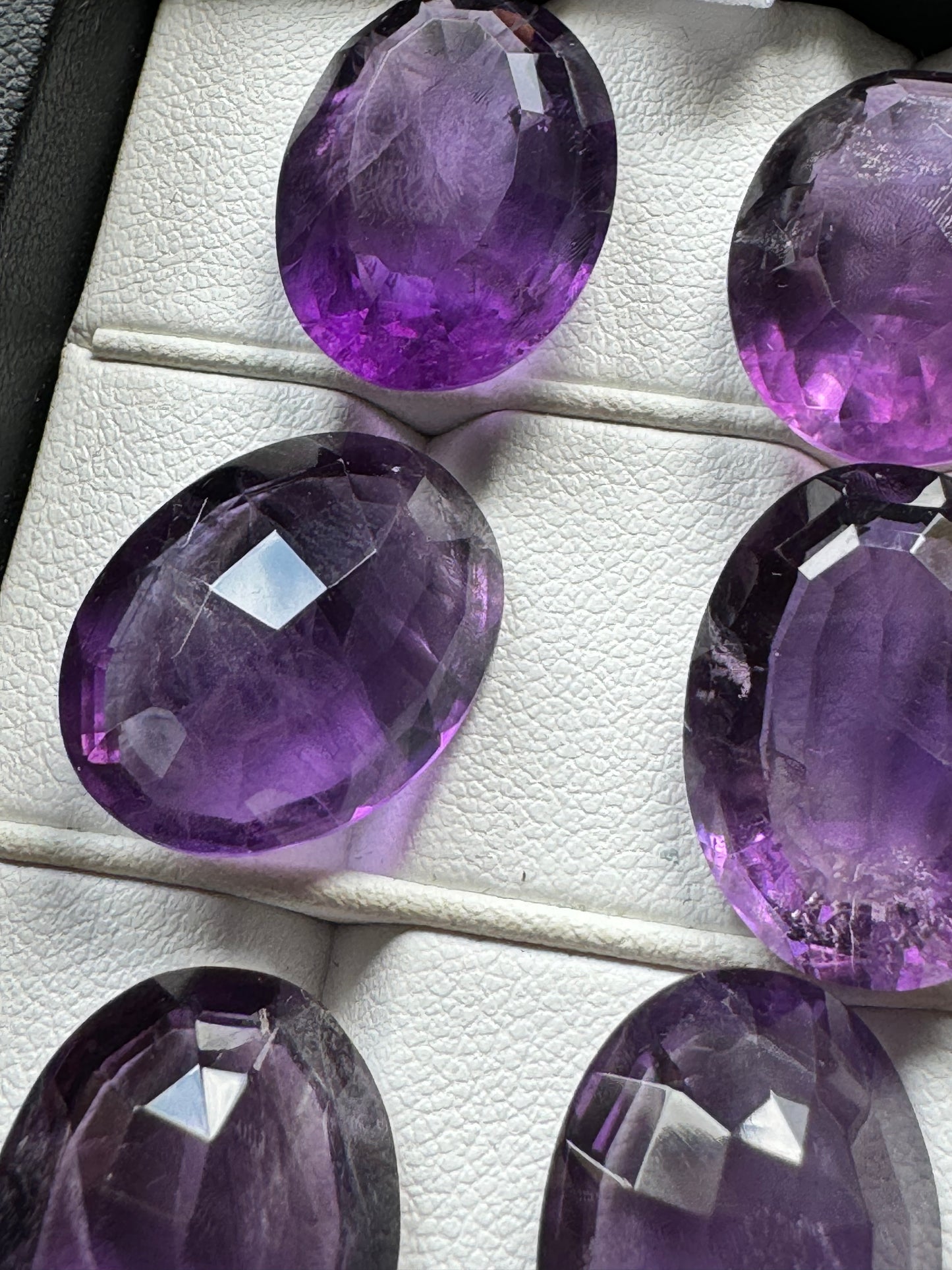 Amethyst Oval Faceted Gemstones With Deep Purple And Inclusions