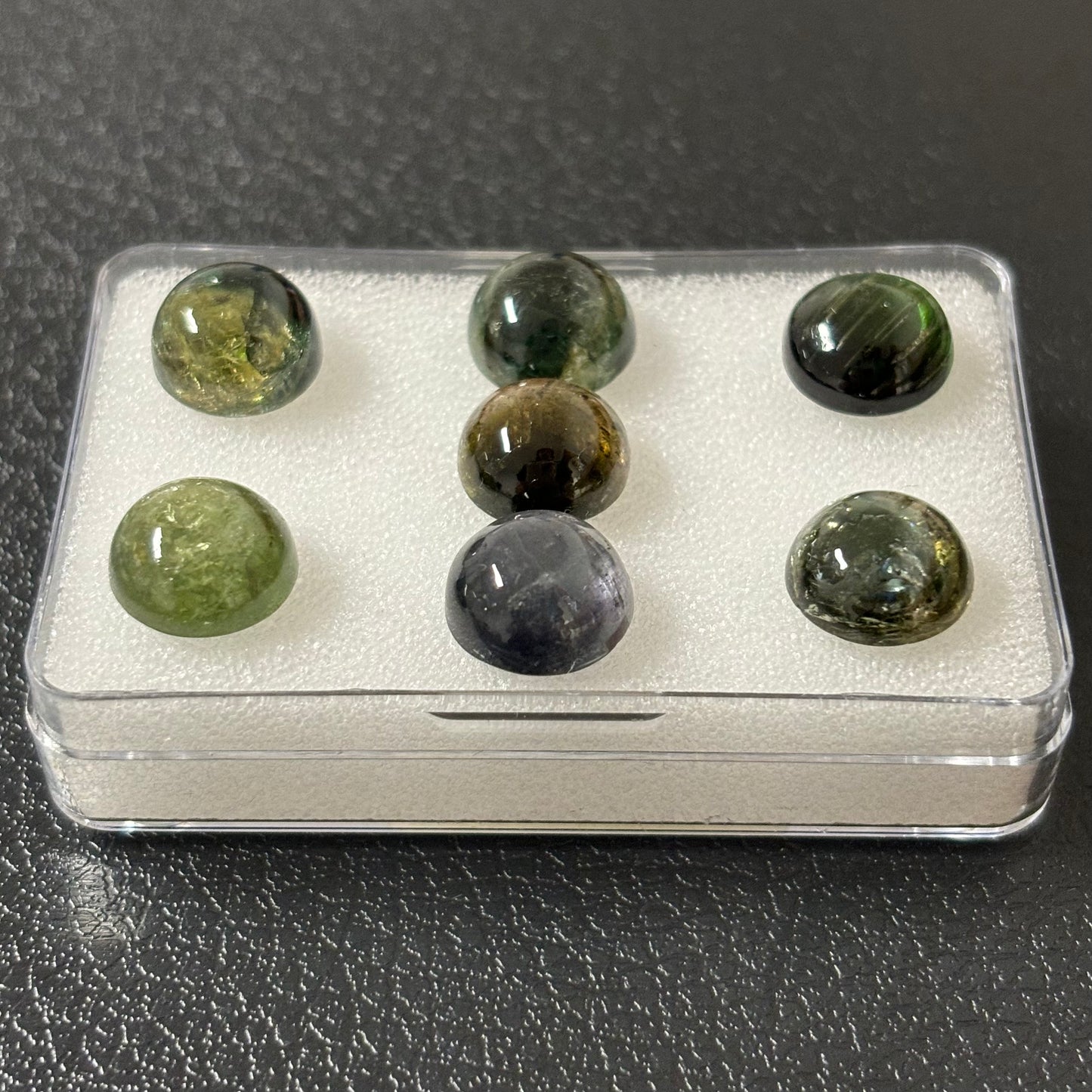 Tourmaline round cabochon with inclusions approx. 10 mm 4.56 Cts.