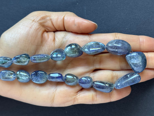 Tanzanite 401.76 cts Oval Tumbled Strand With Inclusions 43cm