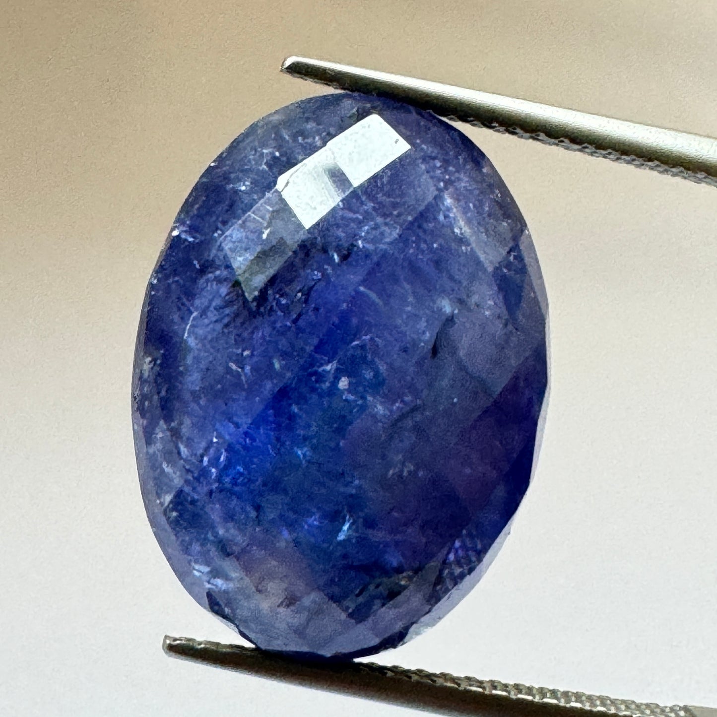 Ink blue Tanzanite oval Cabochon Faceted 19,3mm x 14,2mm 20,75cts