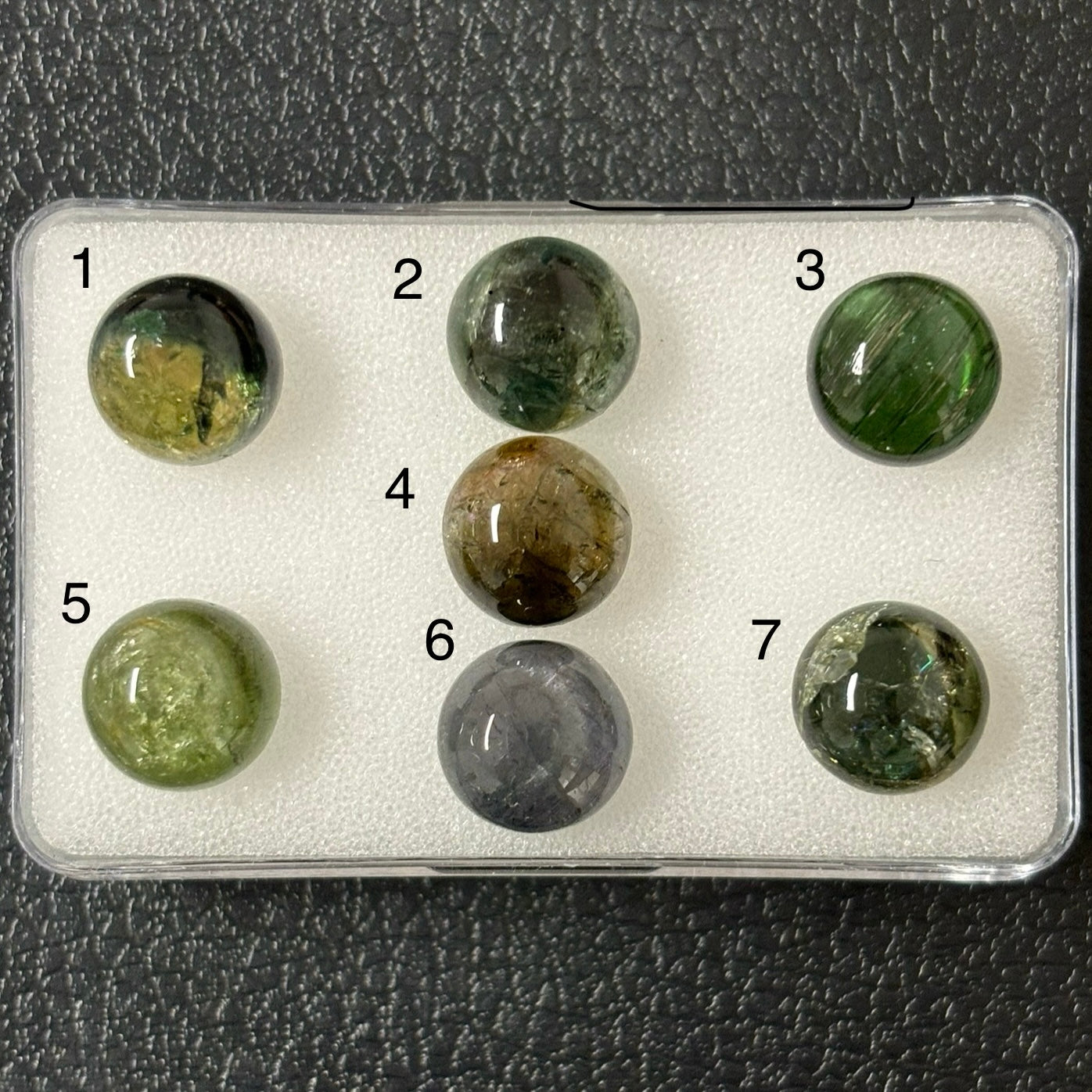 Tourmaline round cabochon with inclusions approx. 10 mm 4.56 Cts.