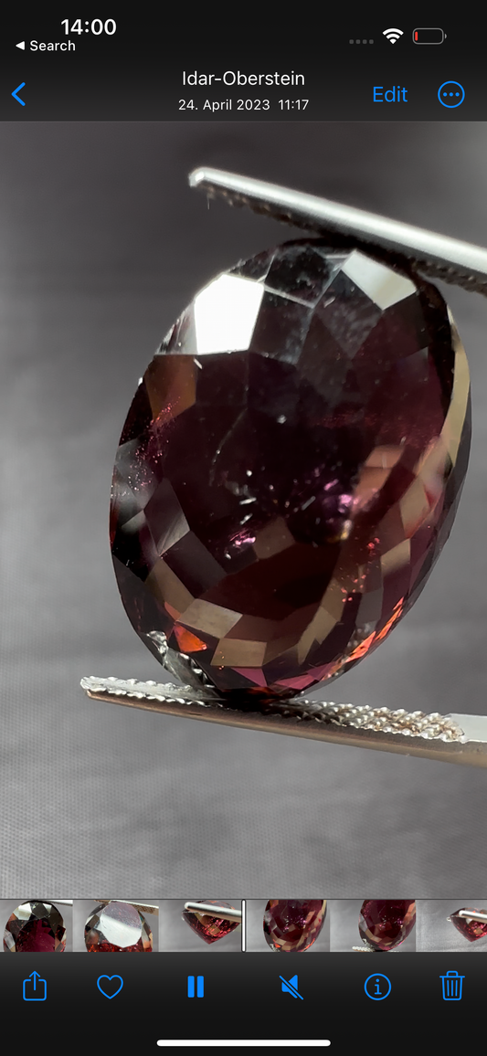 Wine-red Tourmaline, oval, star cut, 17.02cts, 19.4x14.4x9.5mm