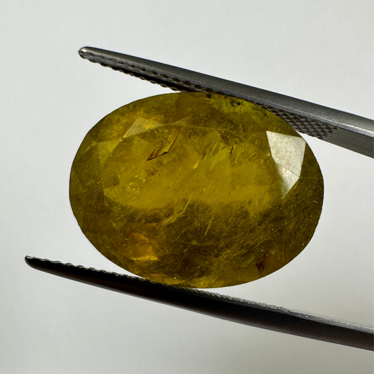 EB001315 Vibrant yellow-green colour in an elegant oval shape. Tourmaline, 19.30 cts, 19x 14.3x 10.9 mm