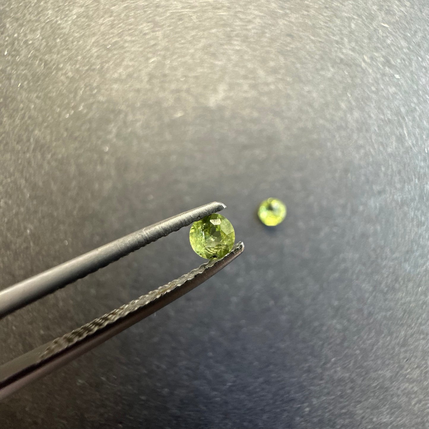 Peridot round pair, approx. 3.4mm&3.3mm diameters, 0.29cts