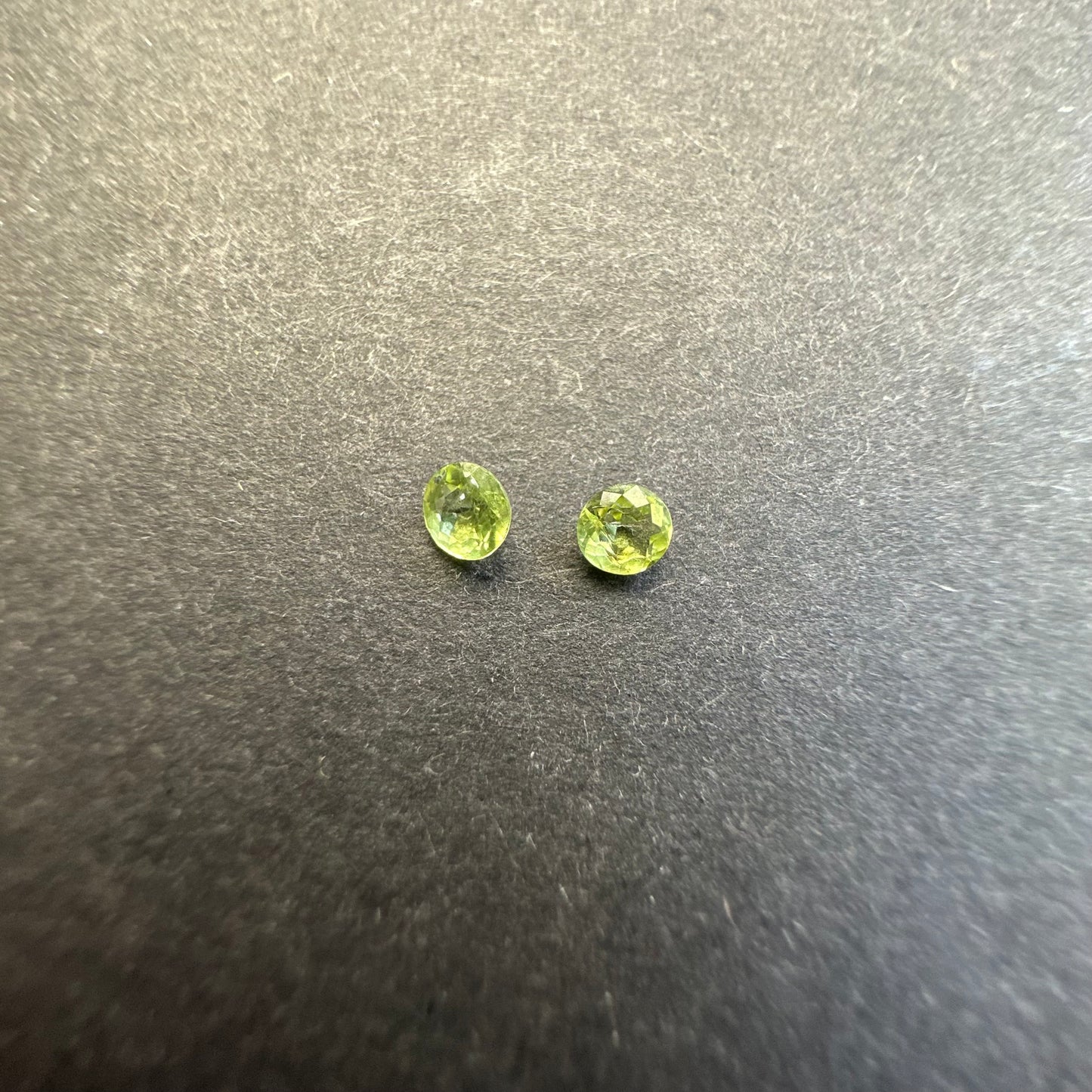 Peridot round pair, approx. 3.4mm&3.3mm diameters, 0.29cts