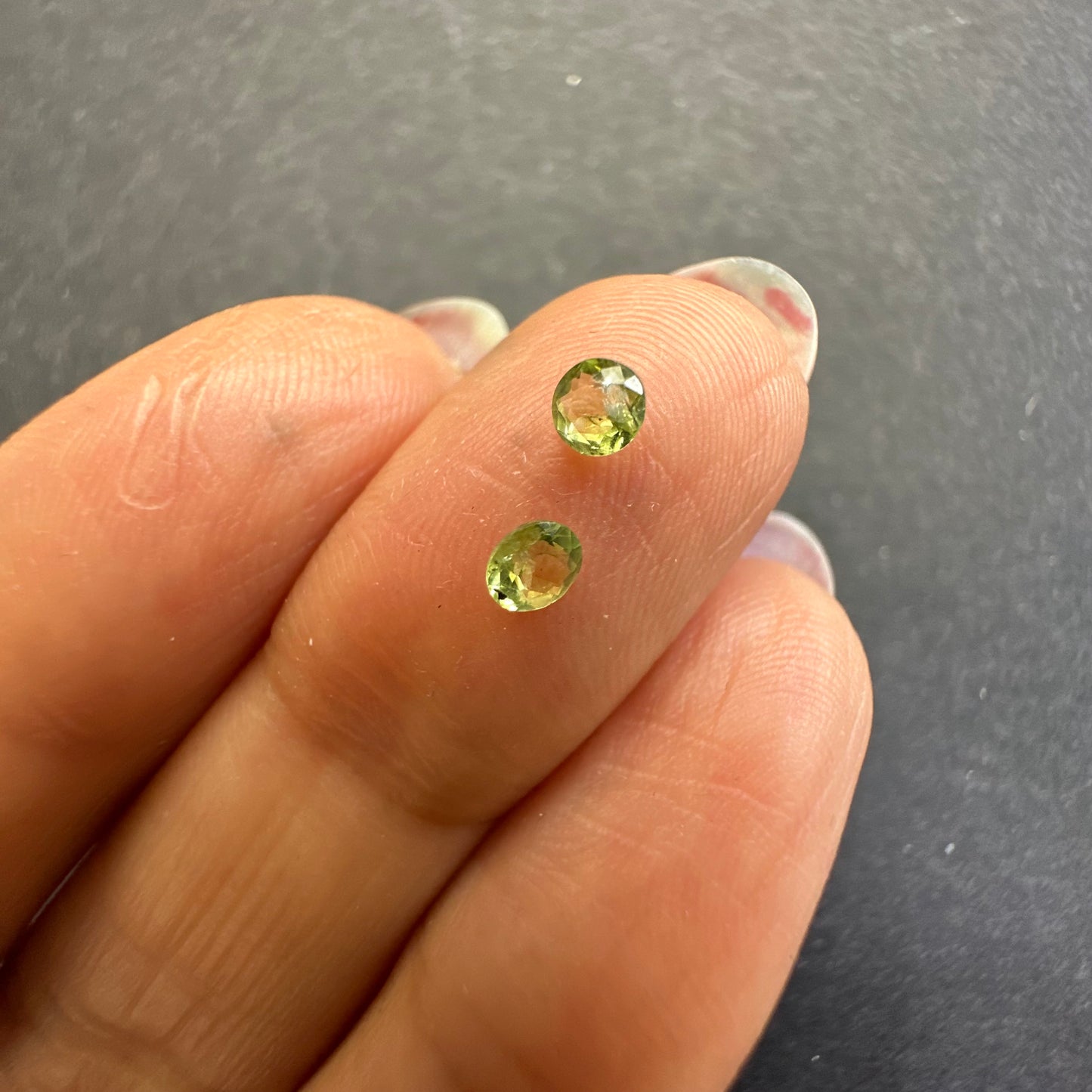 Peridot round pair, approx. 3.4mm&3.3mm diameters, 0.29cts
