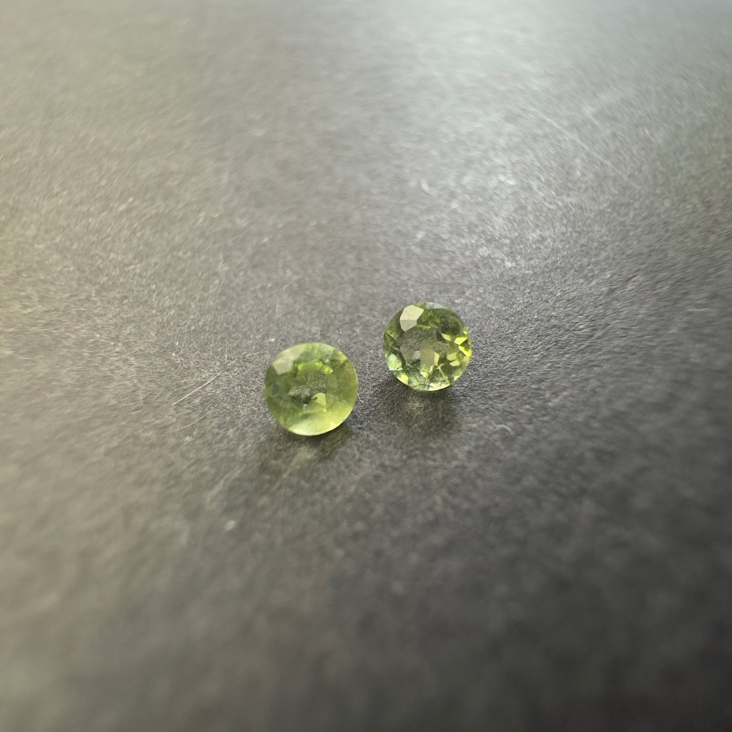 Peridot round pair, approx. 3.3mm diameters, 0.30cts
