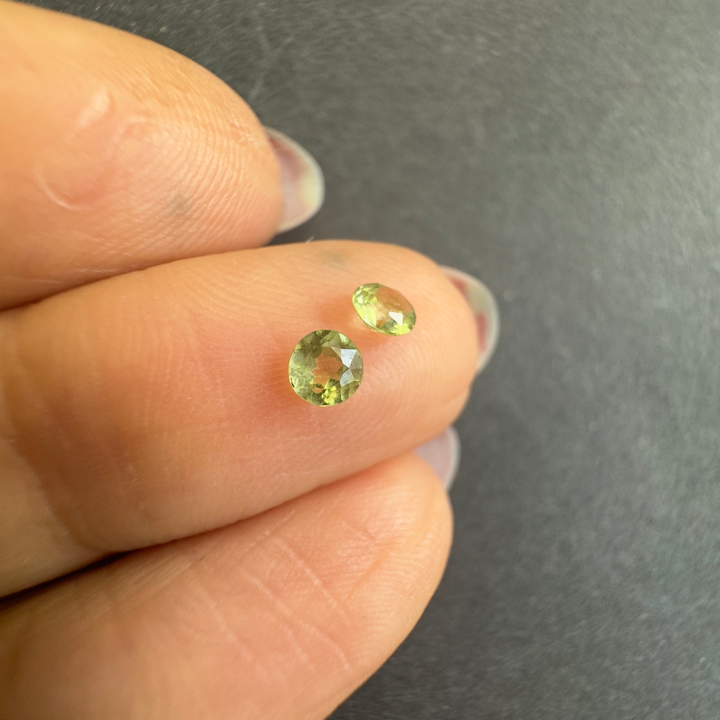 Peridot round pair, approx. 3.3mm diameters, 0.30cts