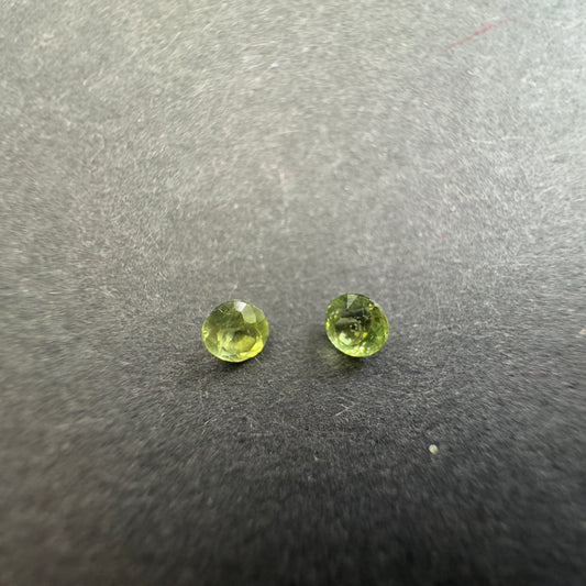 Peridot pair, round star cut, approx. 3.3mm & 3.1mm diameters, 0.30cts