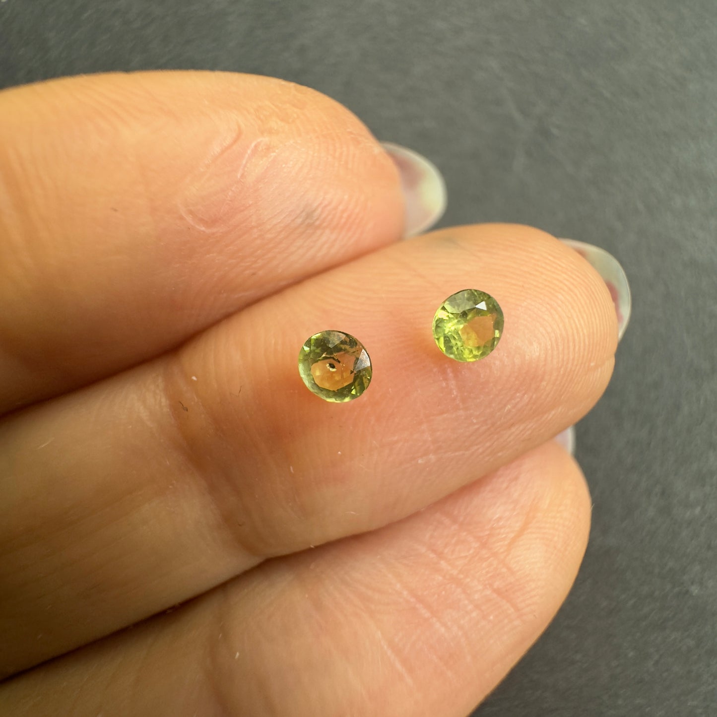 Peridot pair, round star cut, approx. 3.3mm & 3.1mm diameters, 0.30cts
