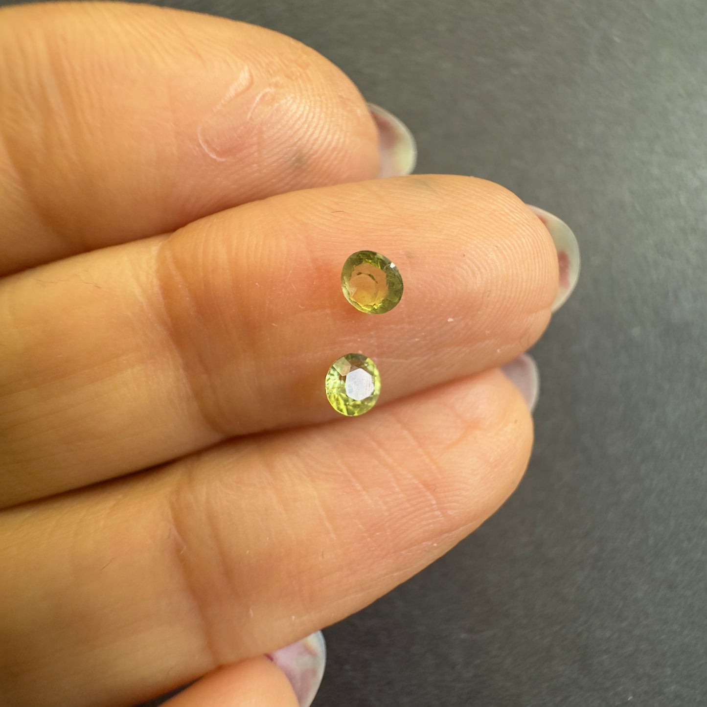 Peridot round pair, both approx. 3.3mm diameters, 0.31cts