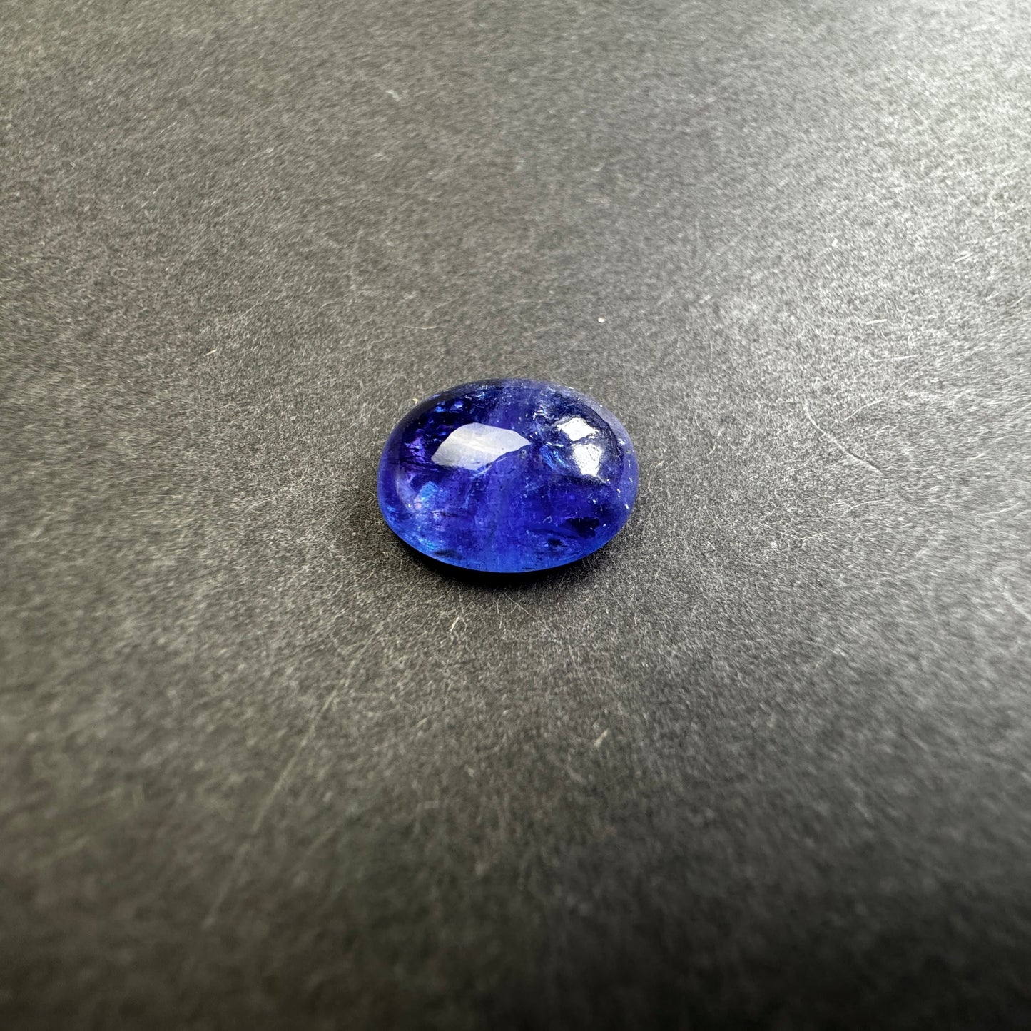 Shiny Tanzanite Cabochon with Playful Inclusions 8.64cts