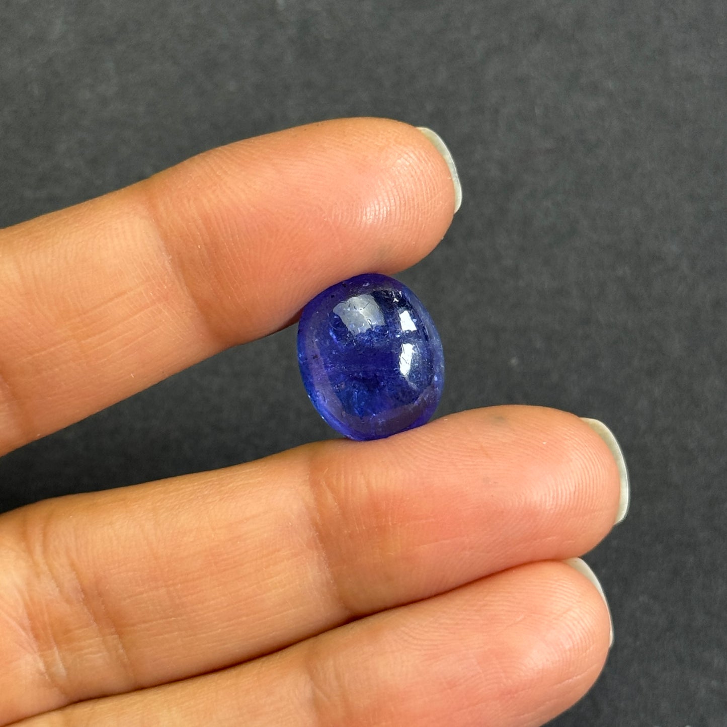 Shiny Tanzanite Cabochon with Playful Inclusions 8.64cts