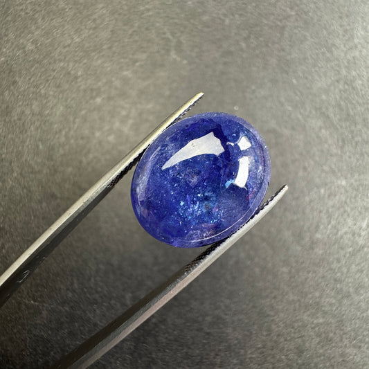 Tanzanite deep indigo blue with inclusions.