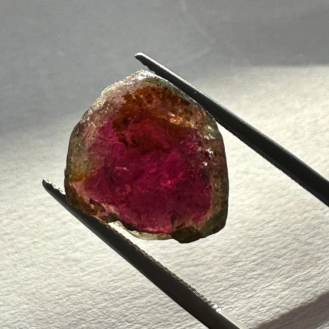 Watermelon tourmaline crystal showing a pink core and green rim