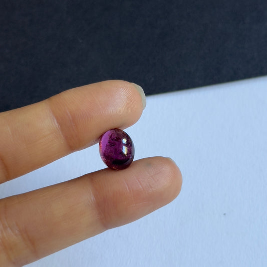 Dance of Light within this oval purple Tourmaline Cabochon 4.88cts