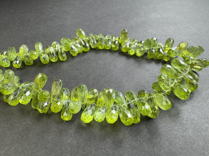 Green Peridot Drop Faceted Beads, 335.16 ct, 9.61x5.23 mm, 42 cm – view 1 of 2