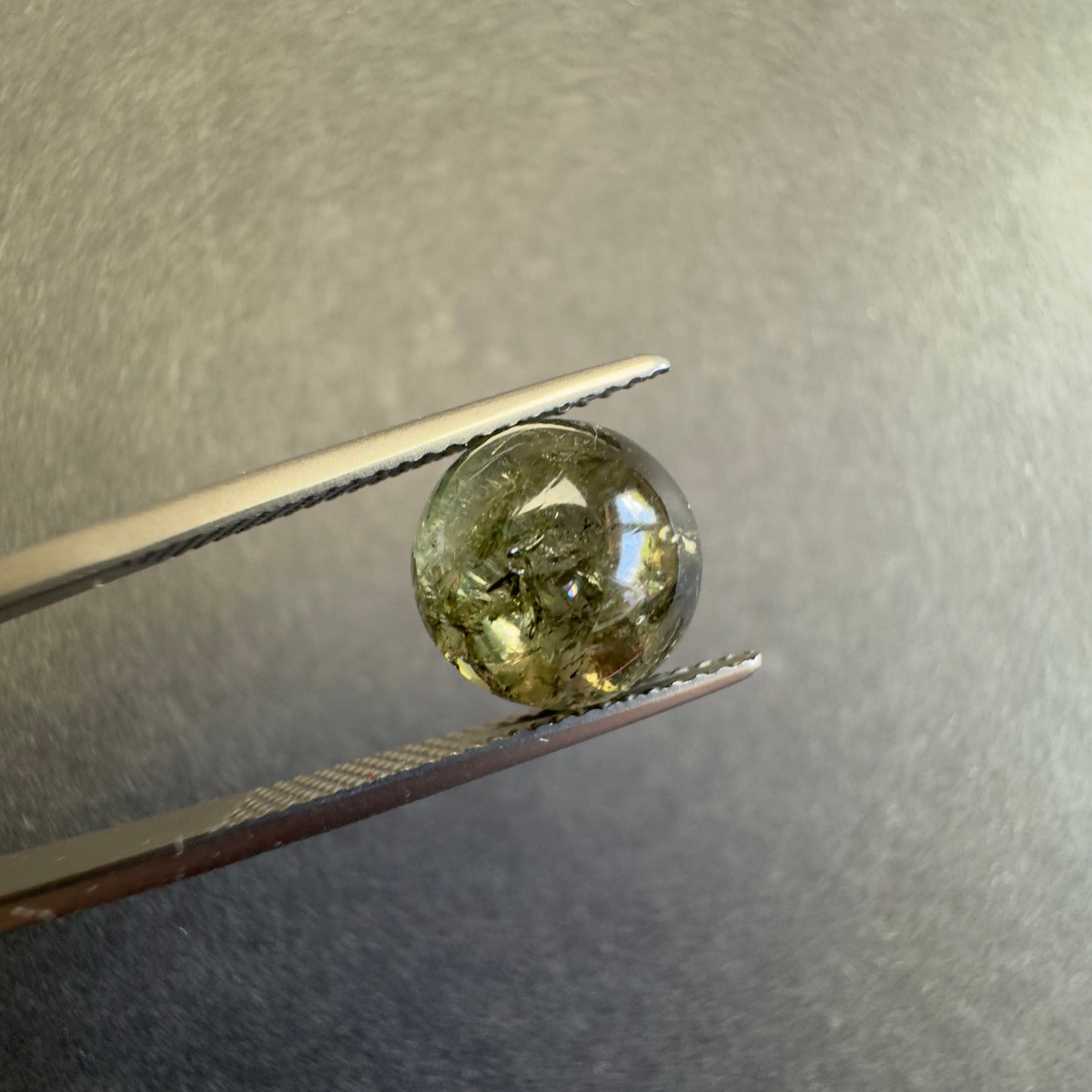 Beautiful forest green hues that capture light with natural elegance ! 10mm Tourmaline