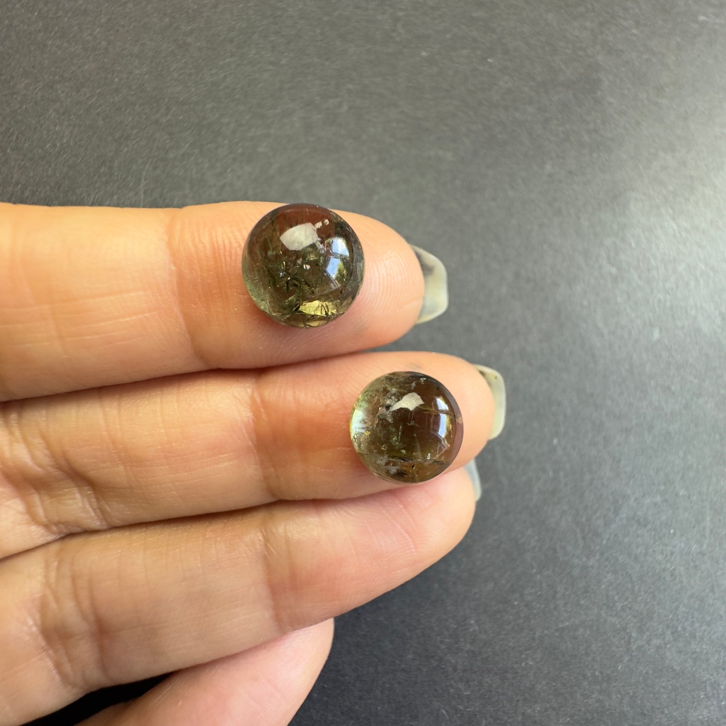 Beautiful forest green hues that capture light with natural elegance ! 10mm Tourmaline