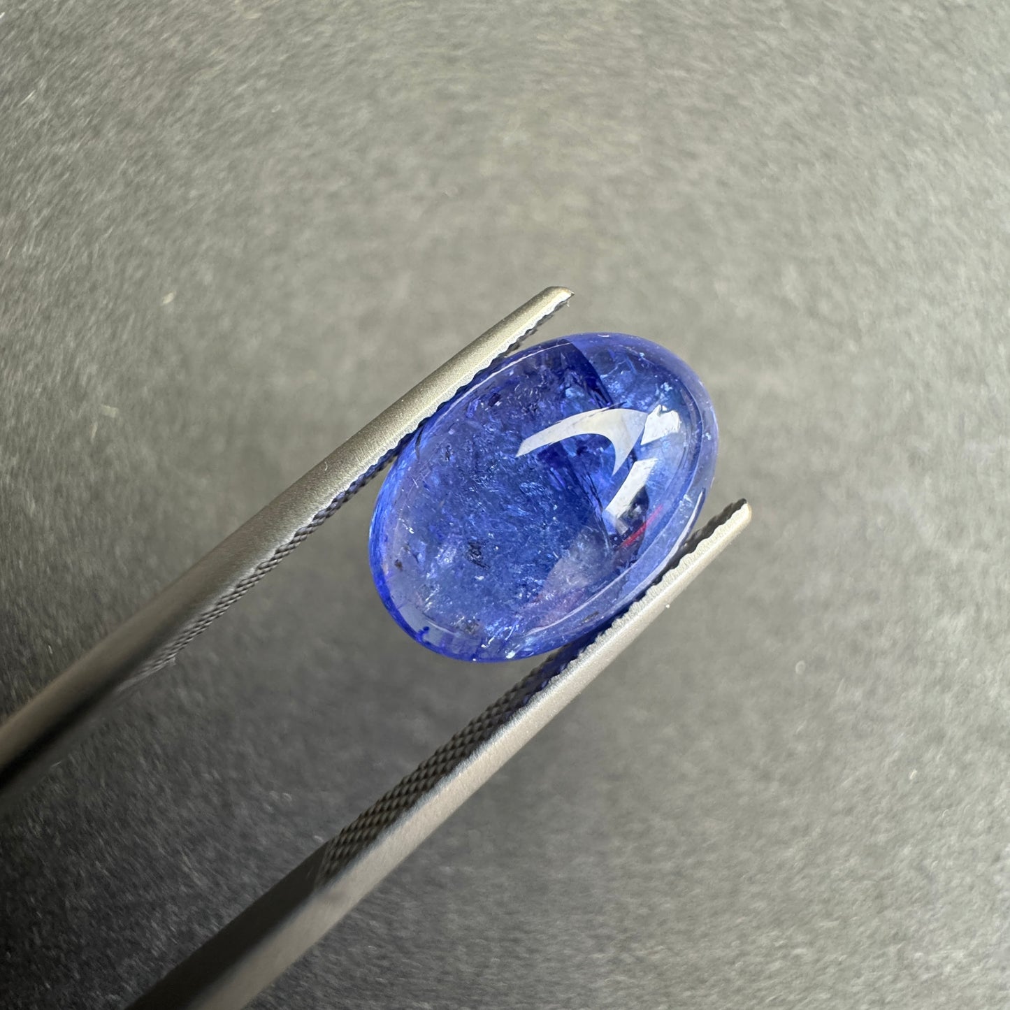 Dark blue oval silhouette shines in deep indigo