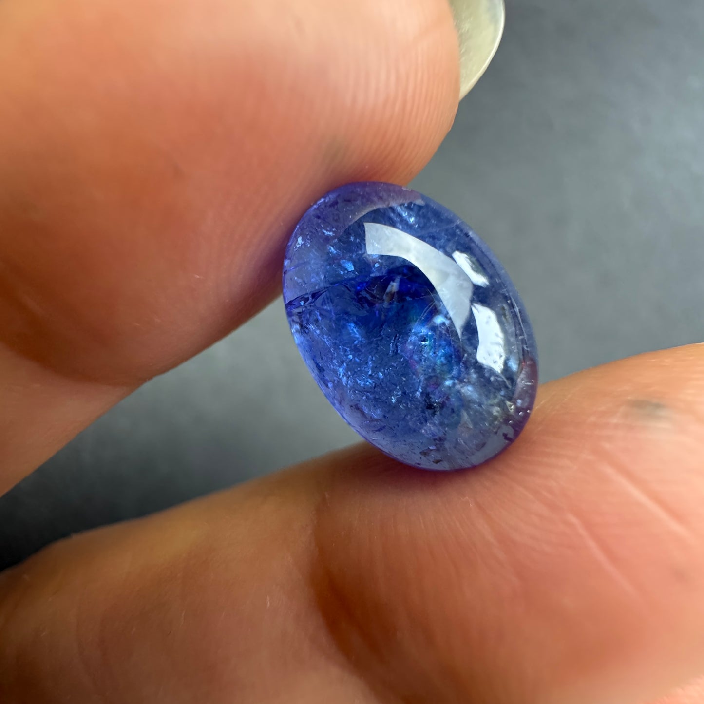 Dark blue oval silhouette shines in deep indigo