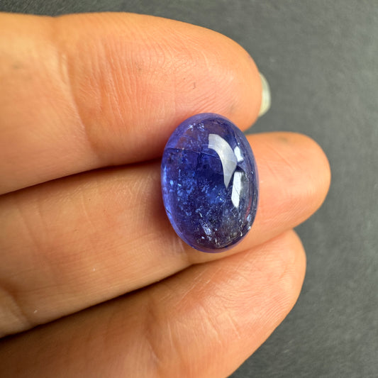 Dark blue oval silhouette shines in deep indigo