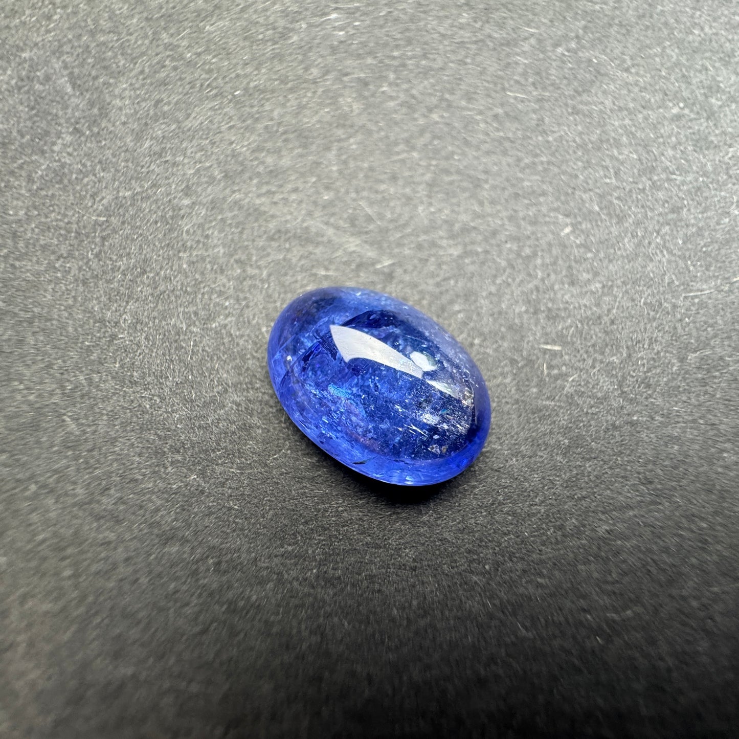 Dark blue oval silhouette shines in deep indigo