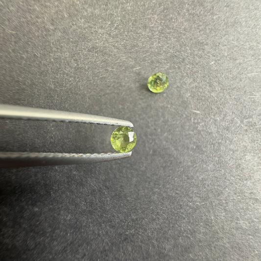 Peridot pair, round star cut, approx. 3.3mm & 3.1mm diameters, 0.30cts