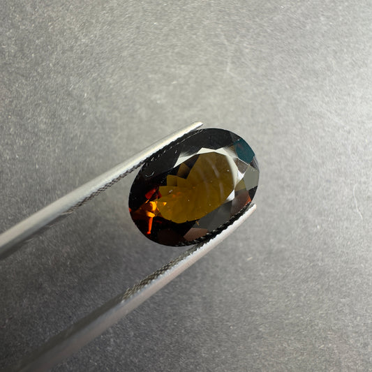 Irresistible Allure of our Intense Dark Oval Faceted Tourmaline