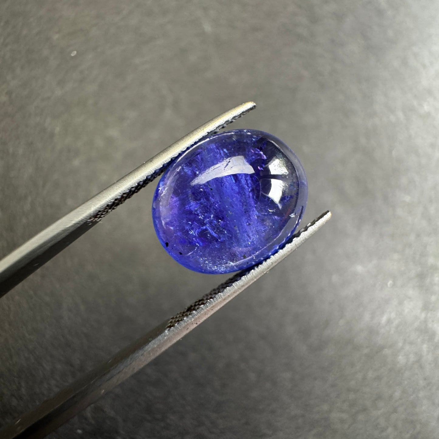 Shiny Tanzanite Cabochon with Playful  Inclusions 8.64cts