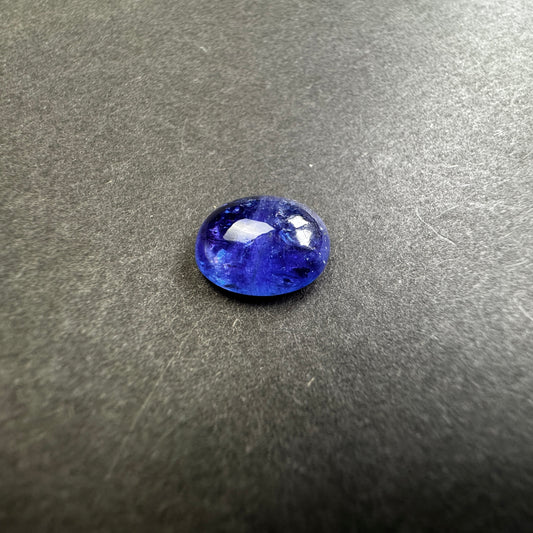 Shiny Tanzanite Cabochon with Playful  Inclusions 8.64cts