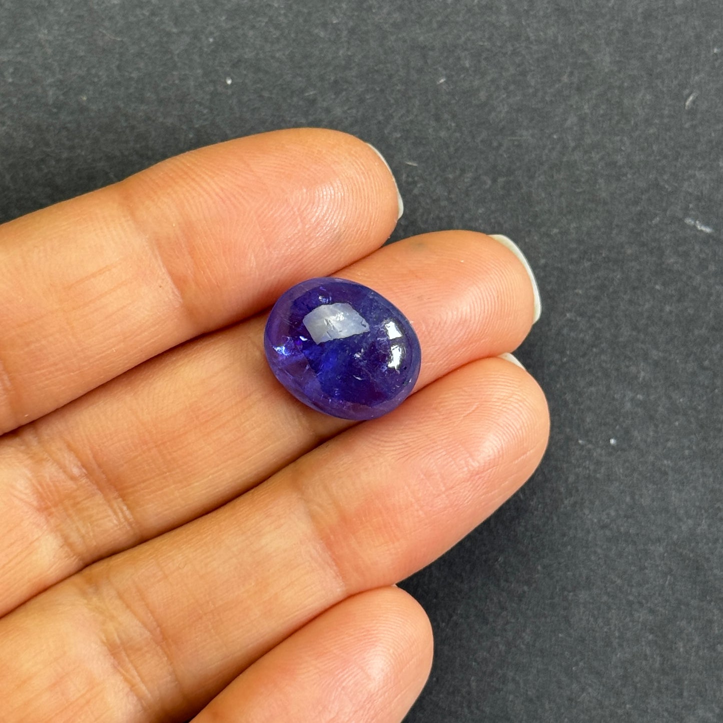 Shiny Tanzanite Cabochon with Playful  Inclusions 8.64cts