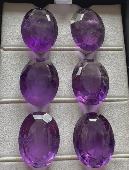 Amethyst Oval Faceted Gemstones With Deep Purple And Inclusions